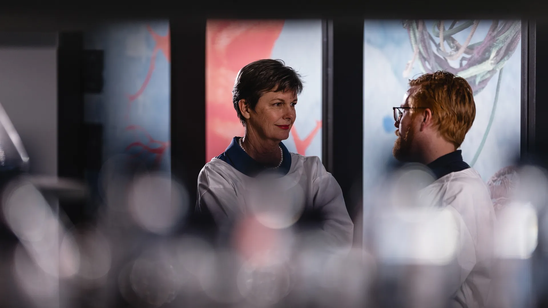 Scientists converse in the lab