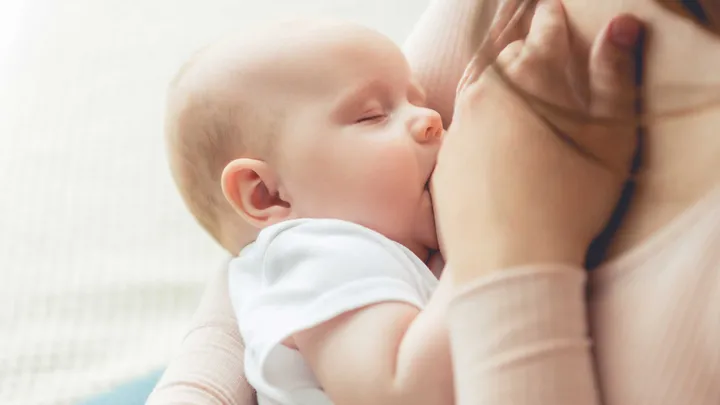 A breast feeding baby