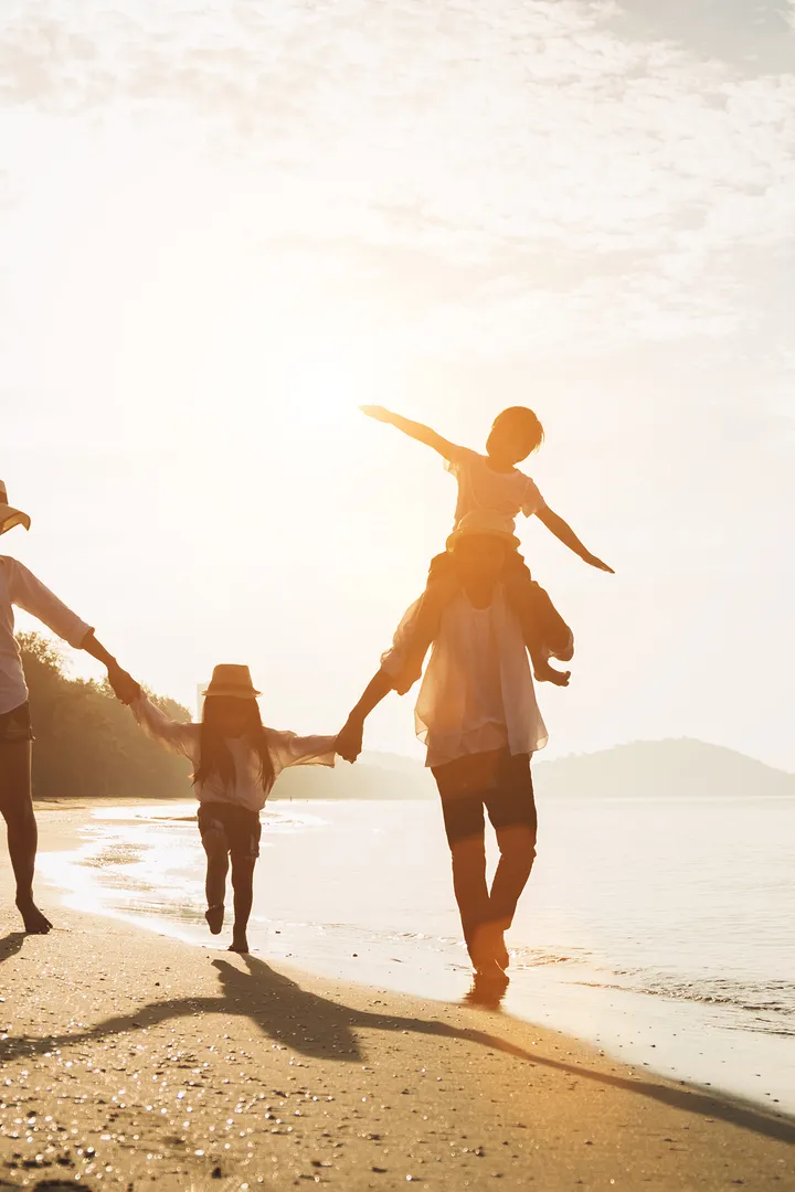 A family walk on the beach