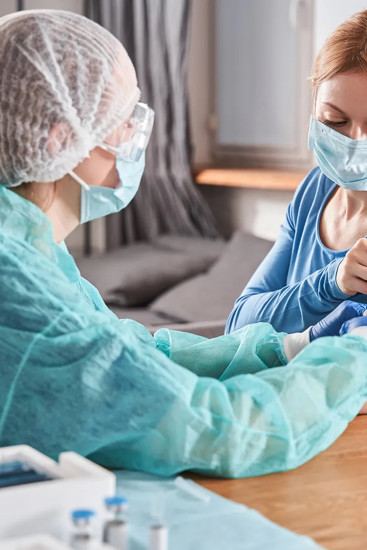 A nurse drawing blood