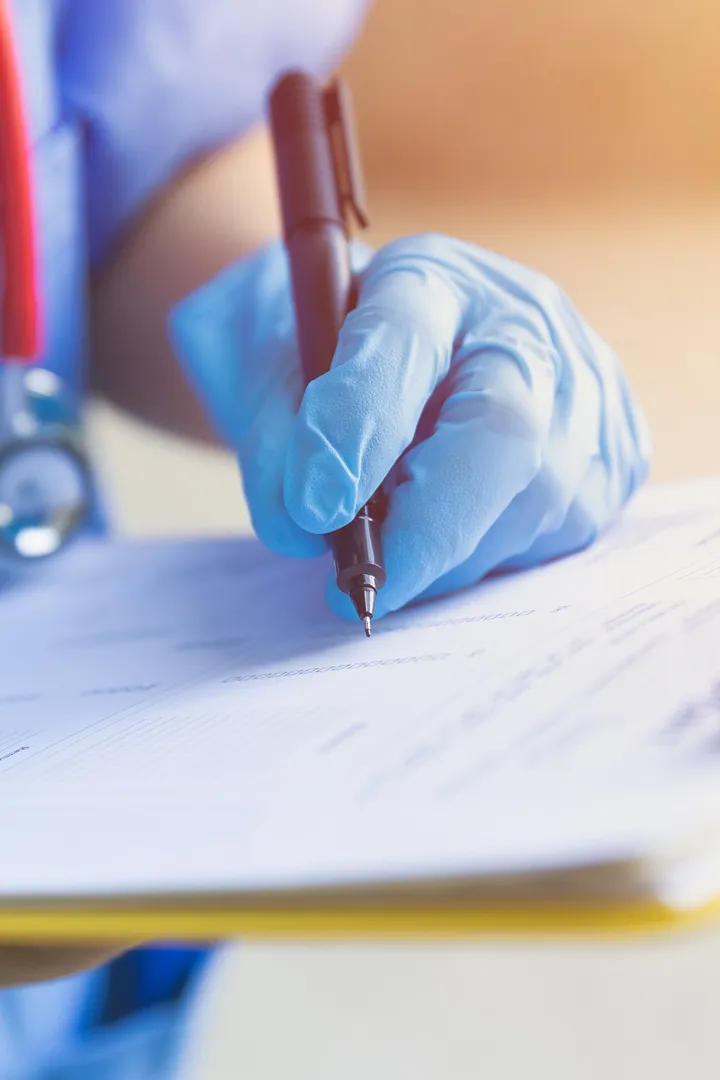 A doctor taking notes