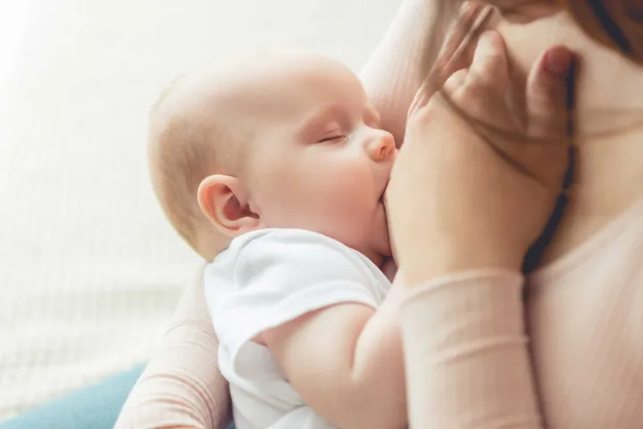 A breast feeding baby